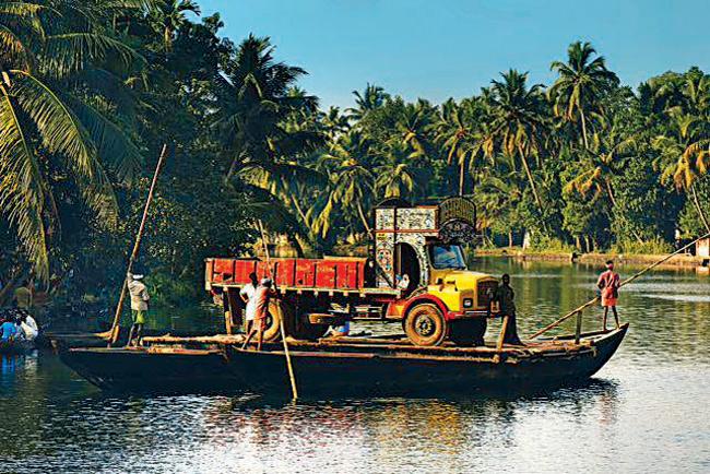 Hitching a ride amidst the coconut trees in the backwaters of Kerala