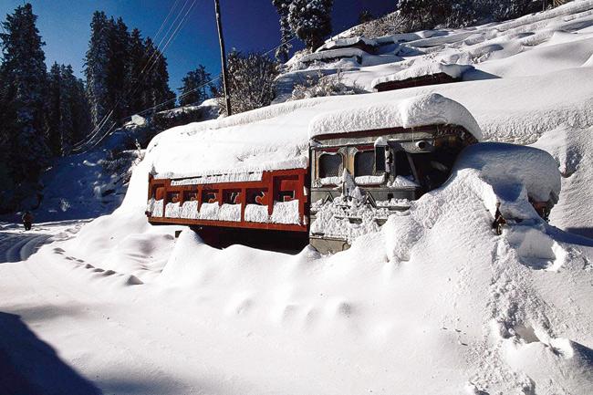 A truck stuck in a snow storm in the Himalayan region