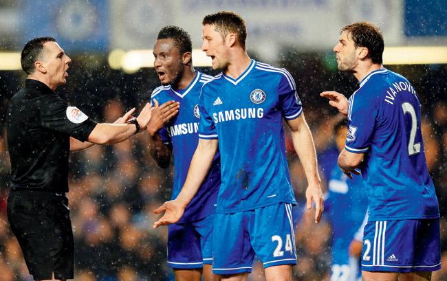 See our point, sir! Chelsea’s John Obi Mikel hand on chest, Gary Cahill and Branislav Ivanovic right appeal to referee Neil Swarbrick during the English Premier League match against West Ham United at Stamford Bridge on Wednesday in London. Pic/Getty Images 
