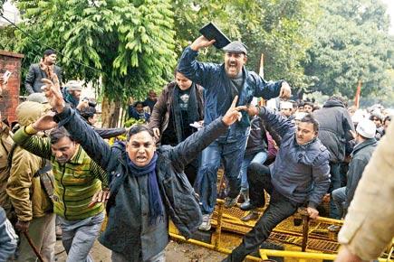 Delhi CM claims victory, ends violent protest
