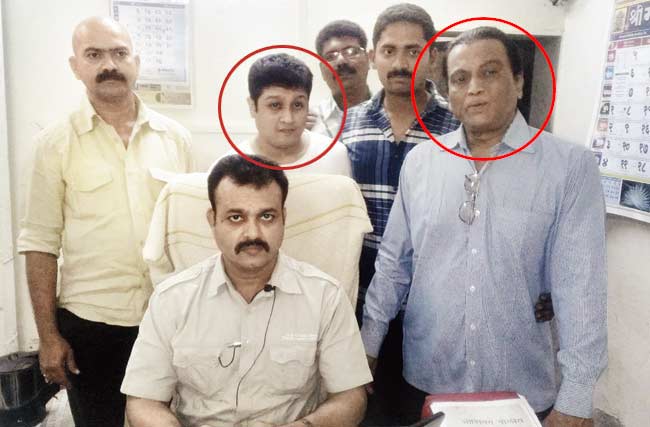 Chandrakant Mukherjee (circled, right) and his son Samarth (circled, left) at the Oshiwara police station