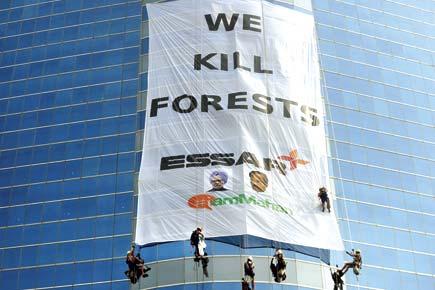 Activists posing as cleaning staff, unfurl banner on Essar House