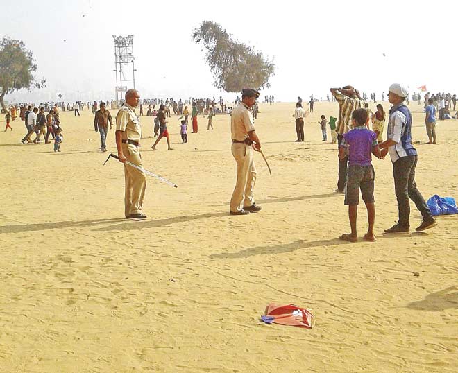 Police officers prevented people from flying their kites at the Girgaum Chowpatty in compliance of a 2005 HC order