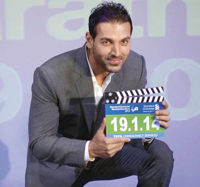 John Abraham holds the date