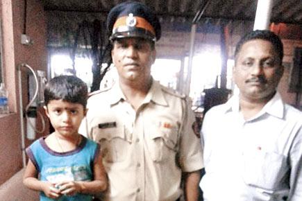 Cop, phone booth owner rescue child within an hour of his abduction