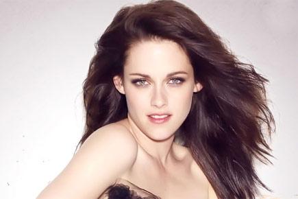 Kristen Stewart goes topless for new perfume ad