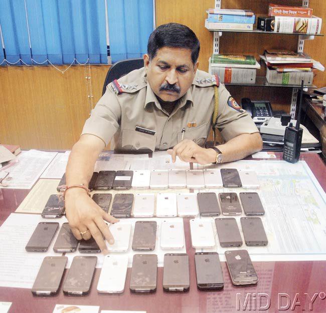 Railway police recovered 36 stolen iPhones from the two men, one of whom is a Rajdhani train attendant. Pic/ Milind Karekar