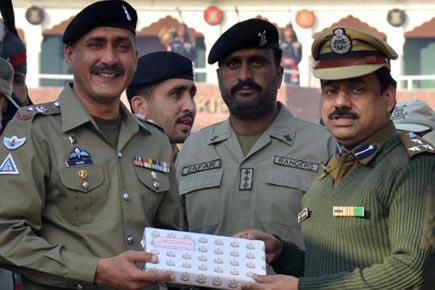 BSF officers exchange sweets with Pakistan Rangers at Wagah Border	