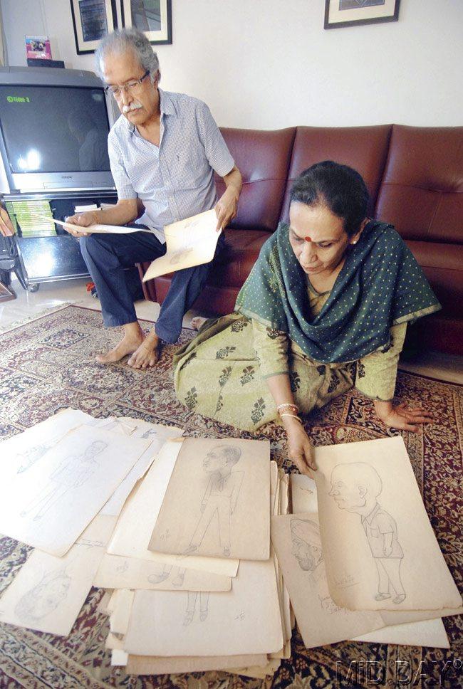 Shakuntala and Raja, daughter and son-in-law of late police inspector Balchandra Haldipur, go through sketches made by the cop, including one of Godse. Pic/Sameer Markande