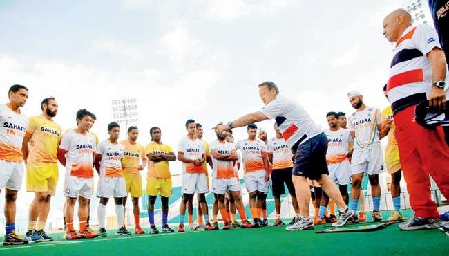 India coach Terry Walsh (in foreground) gives instructions to his team in New Delhi