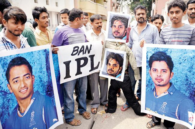 Demonstrators hold posters and shout slogans against S Sreesanth, Ankeet Chavan and Ajit Chandila in Bangalore in 2013. Pic/AFP 