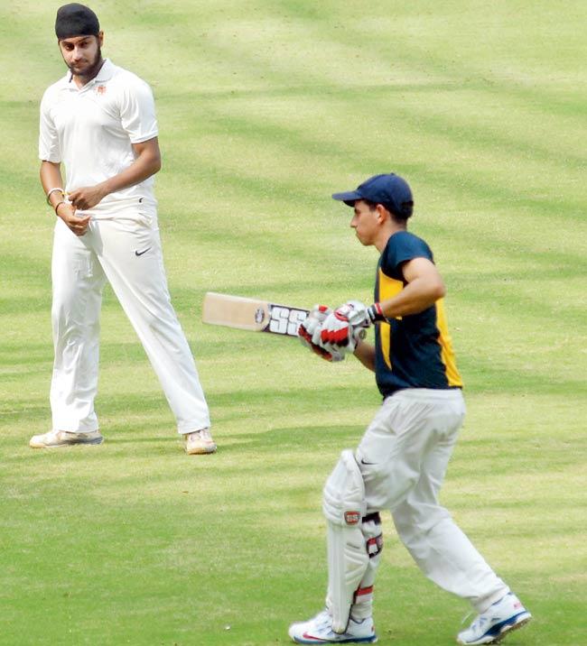Mumbai Ranji Trophy player Siddhesh Lad does some knocking while Harmeet Singh looks on at the Wankhede Stadium last November. File pic