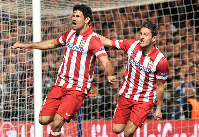 Atletico Madrid-s Brazilian-born forward Diego da Silva Costa L celebrates scoring his team-s second goal with Atletico Madrid-s Spanish midfielder Koke during the UEFA Champions League semi-final second leg football match between Chelsea and Atletico Madrid at Stamford Bridge in London on yesterday. Pic/AFP
