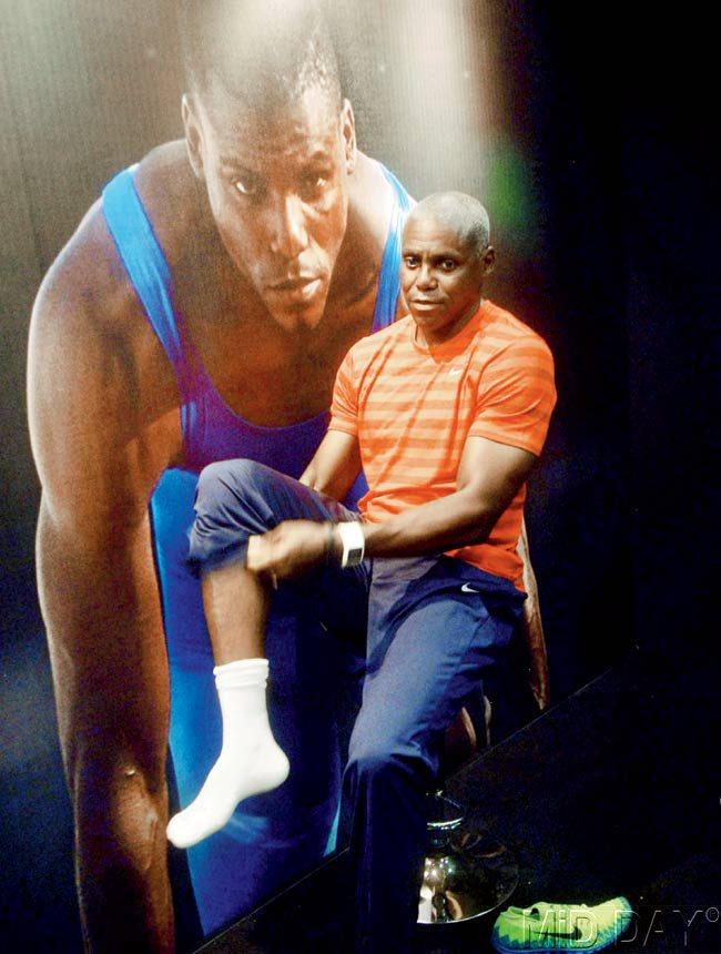 Olympic champion Carl Lewis gets ready to give his footprint at an event in Bandra yesterday. Pic/Pradeep Dhivar