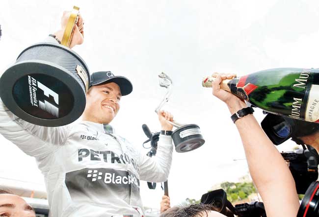 Nico Rosberg celebrates his Monaco Grand Prix win in Monte Carlo yesterday. Pic/AFP