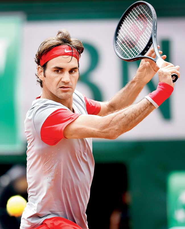 Roger Federer returns to Lukas Lacko during the French  Open Round One match yesterday. Pic/Getty Images