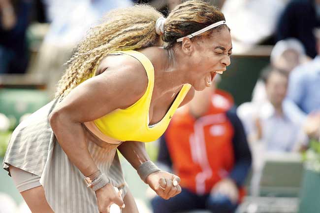 Serena Williams celebrates after winning a point yesterday. Pic/AFP