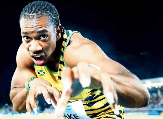 Yohan Blake poses after creating a new world record on Saturday. Pic/Getty Images