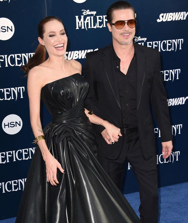 Angelina Jolie and Brad Pitt arrive for the world premiere of Disney