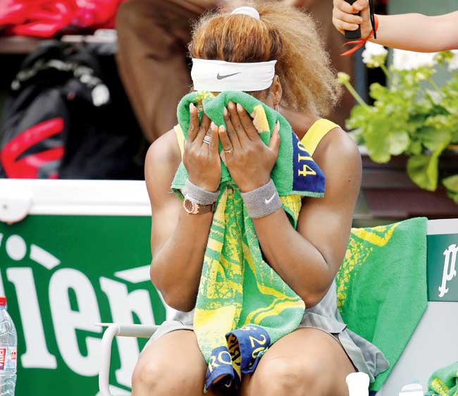 Serena Williams reacts during a break at Roland Garros yesterday. Pic/Getty Images