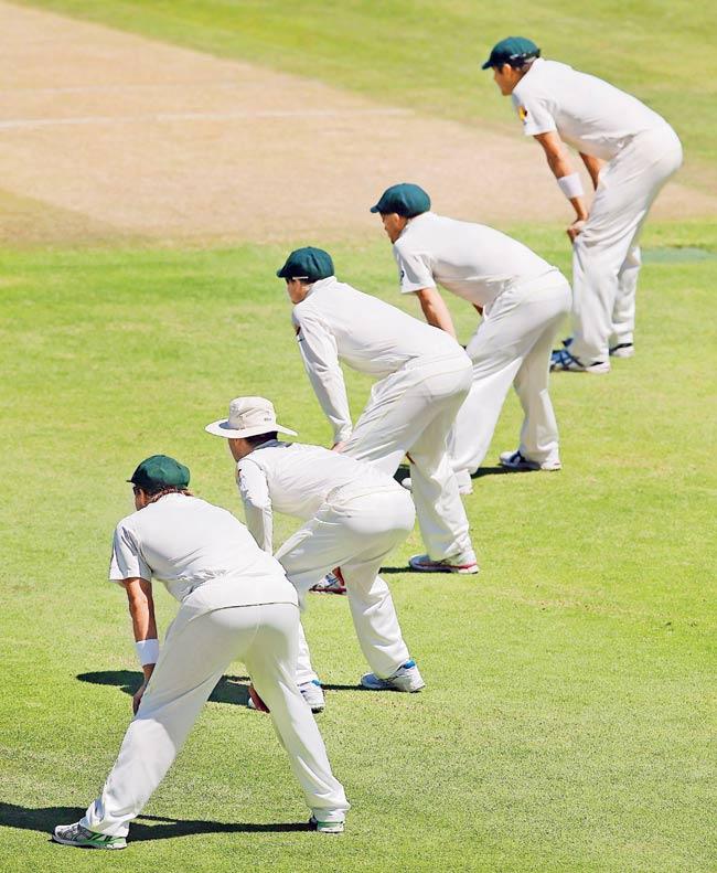 Australian players stand in the slips during Day Five of the third Test against South Africa at Cape Town on March 5, 2014. Pic/Getty Images 