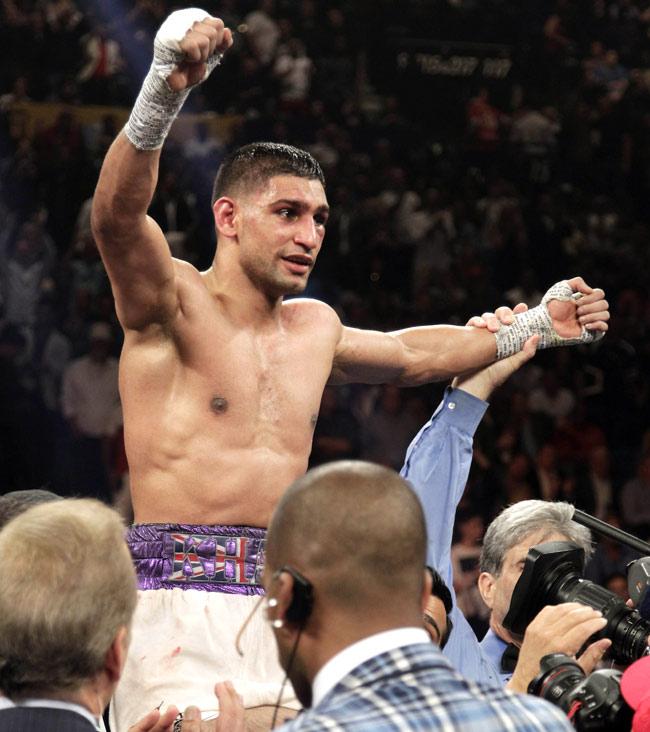 Amir Khan of England celebrates his victory over Luis Collazo of US. Pic/AFP
