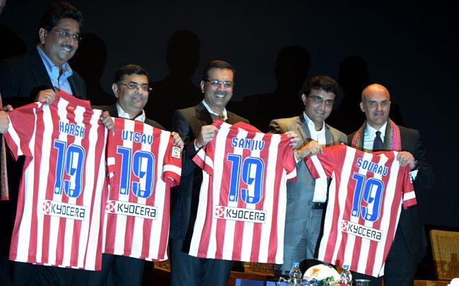 Former Indian cricket captain Sourav Ganguly (2R) and Indian co-owners of the team receive jerseys of Atletico Madrid from owner and CEO, Miguel Angel Marin during a press conference to announce the name of Kolkata franchise "Atletico De Kolkata" of the Indian Super League (ISL) in Kolkata on Wednesday.