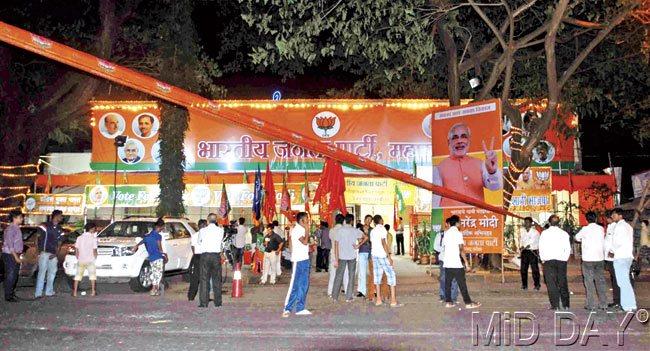 BJP: The air was thick with excitement at the BJP office, with workers decorating it with flags and banners; a huge poster even went to the extent of congratulating the PM aspirant Narendra Modi. Pics/Atul Kamble
