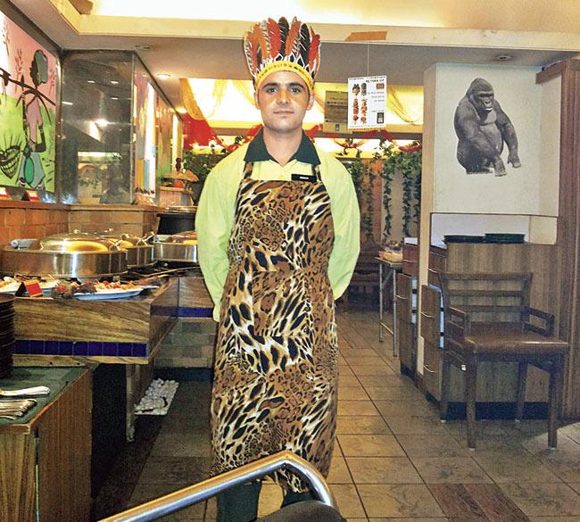A waiter dressed as a tribal chief serves you with a smile. Pic/Dhiman Chattopadhyay