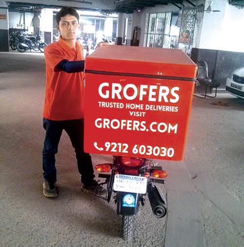 A Grofers employee on his way to deliver goods in Gurgaon