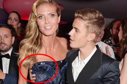 Justin Bieber grabs Heidi Klum's breasts!