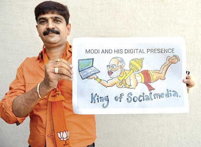 Narendra Modi’s social media presence makes him God-like according to this BJP worker. Pic/AFP