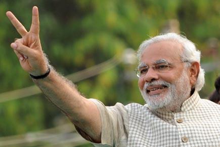 West starts awkward embrace of India's triumphant leader Narendra Modi 