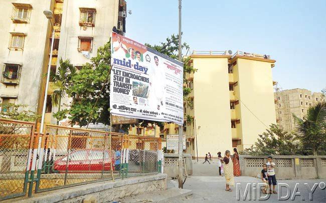 The mid-day story about transit camp encroachments, now part of a hoarding at Pratiksha Nagar. Pic/Suresh KK