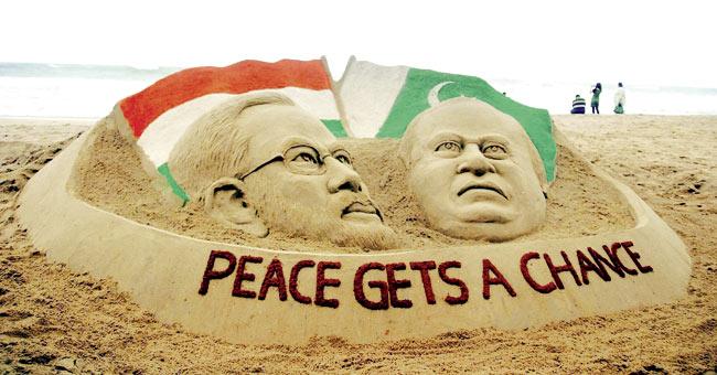 A sand art of Narendra Modi and Nawaz Sharif by Sudarsan Patnaik at Puri beach. Pic/PTI