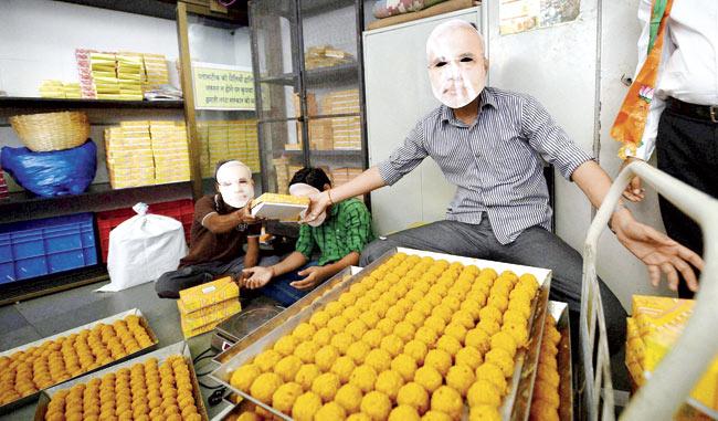 A sweet shop worker in Mumbai prepares laddoos to cater to the increased demand after the BJP’s resounding win in the Lok Sabha elections. Pic/PTI