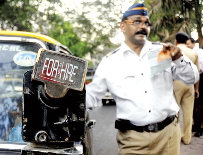 With these old meters making way for the electronic meters inside cabs, passengers can no longer see from a distance if a cab is empty or not. File pic