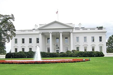 Man held for stripping, standing naked outside White House