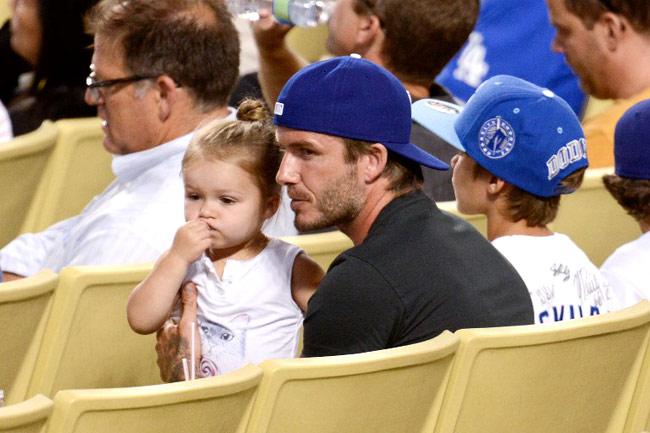 David Beckham and daughter Harper Beckham at a baseball game. Pic/AFP