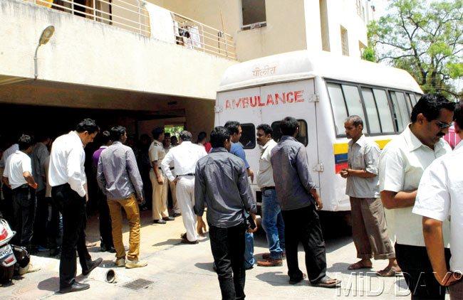 Morning madness: Ambulances and police rushed to the spot after Gaikwad confessed to killing his daughter, mother and wife. The bodies were taken to the hospital for post-mortem
