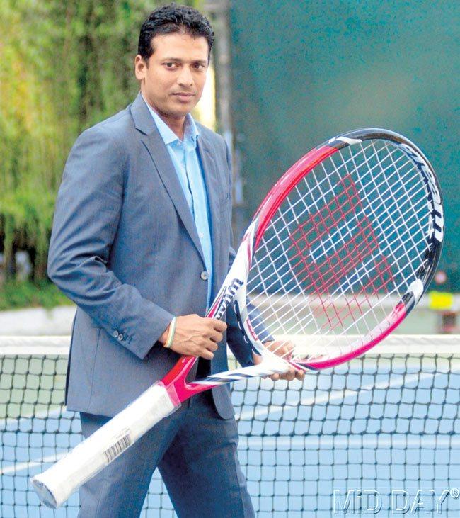 Mahesh Bhupathi poses with a promotional tennis racquet at the CCI yesterday. Pics/Bipin Kokate