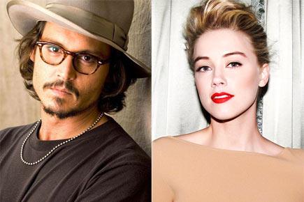 Johnny Depp says he wants to have 100 babies with fiance Amber Heard