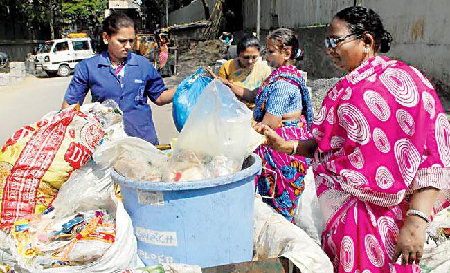Keeping it clean: SwaCH workers are responsible for handling and segregating the trash from people