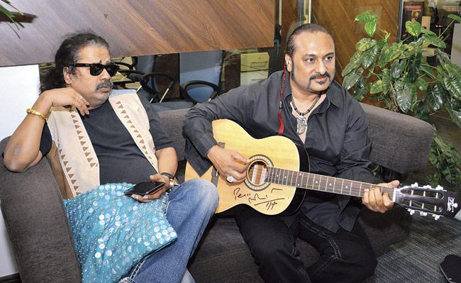 Leslie Lewis (right) with Hariharan