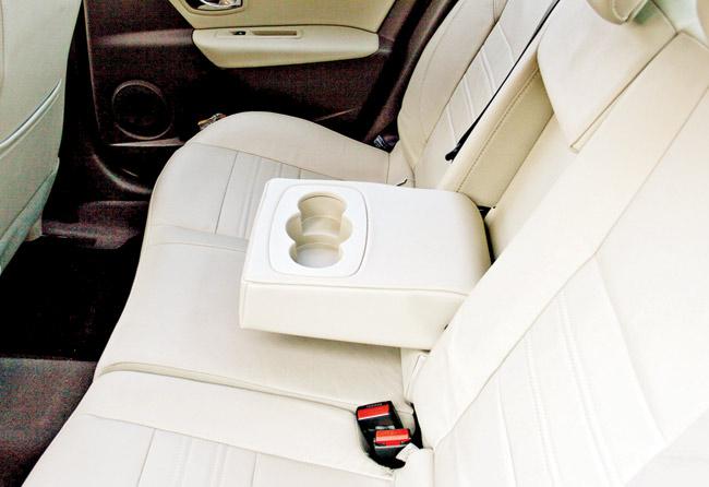 The backseat is plush and comfortable with good under-thigh support. Passengers at the back also get A/C vents and a central armrest with dual cup-holders