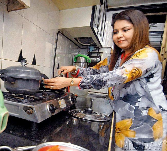 With POTS AND PANS: Singer Sadhana Sargam in her kitchen at her Goregaon residence. Pics/Sameer Markande