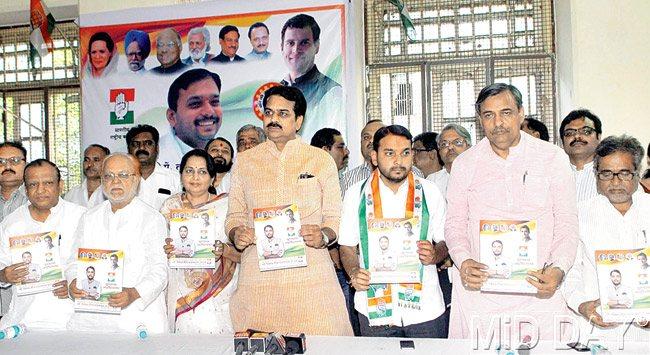 Promises, promises! The party published the manifesto at Congress Bhavan on Sunday. Minister Harshawardhan Patil, Pune LS candidate Vishwajeet Kadam and party’s city chief Abhay Chhajed were present at the release. Pic/Mohan Patil