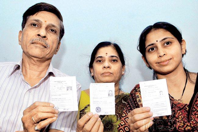 Slip-up: The Methekars of Hadapsar hold up their voting slips which mention their address incorrectly. Pic/Mohan Patil