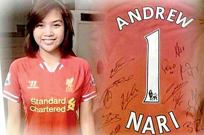 Maira Elizabeth Nari with the LIverpool jersey dedicated by the club to her late father, who was the head steward of the missing MH730 aircraft