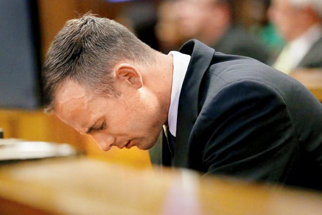 South African sprinter Oscar Pistorius reacts during his trial at the North Gauteng High Court in Pretoria yesterday. Pic/AFP